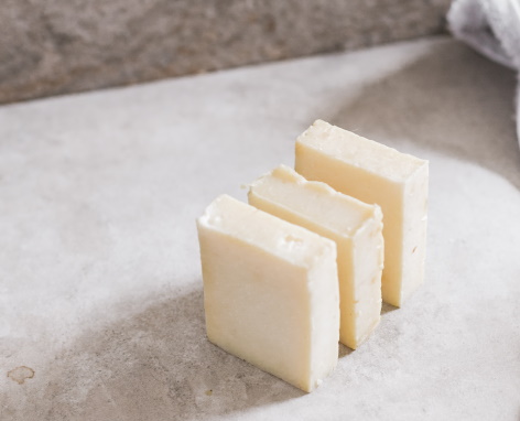 Three slices of butter standing in a row