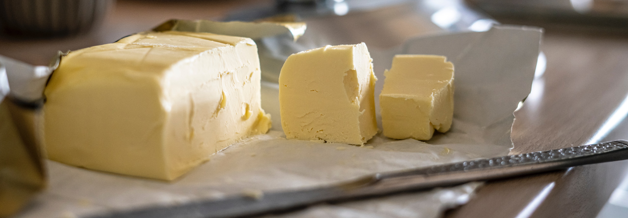 Large cube of butter with pieces cut off