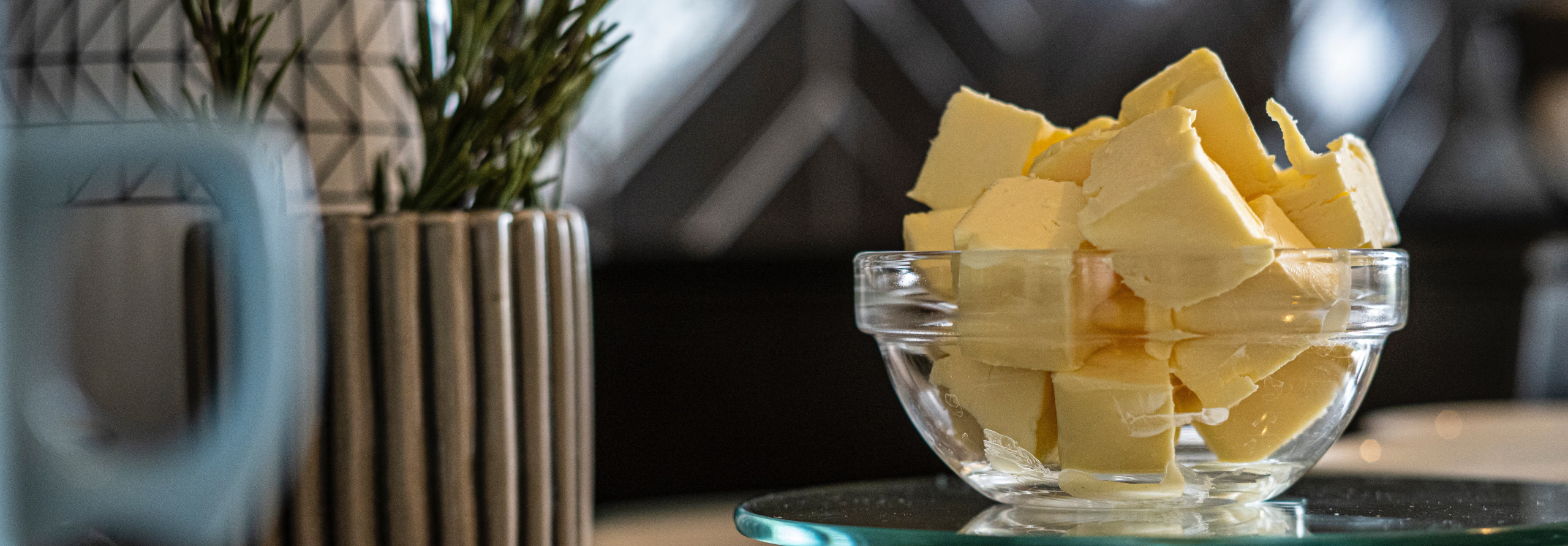 Chunks of butter in a glass bowl