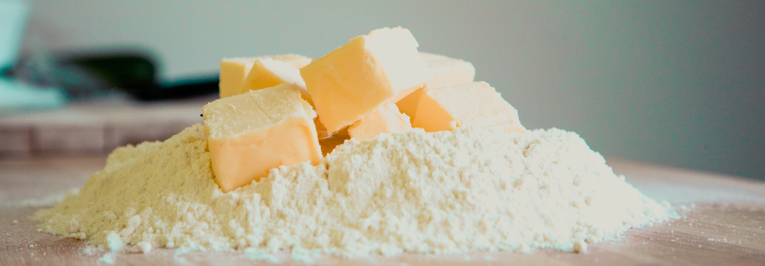 Slices of butter on top of flour